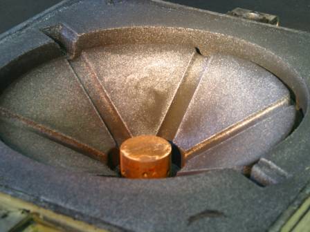 Sandgussform mit einegegossenem Metallkern